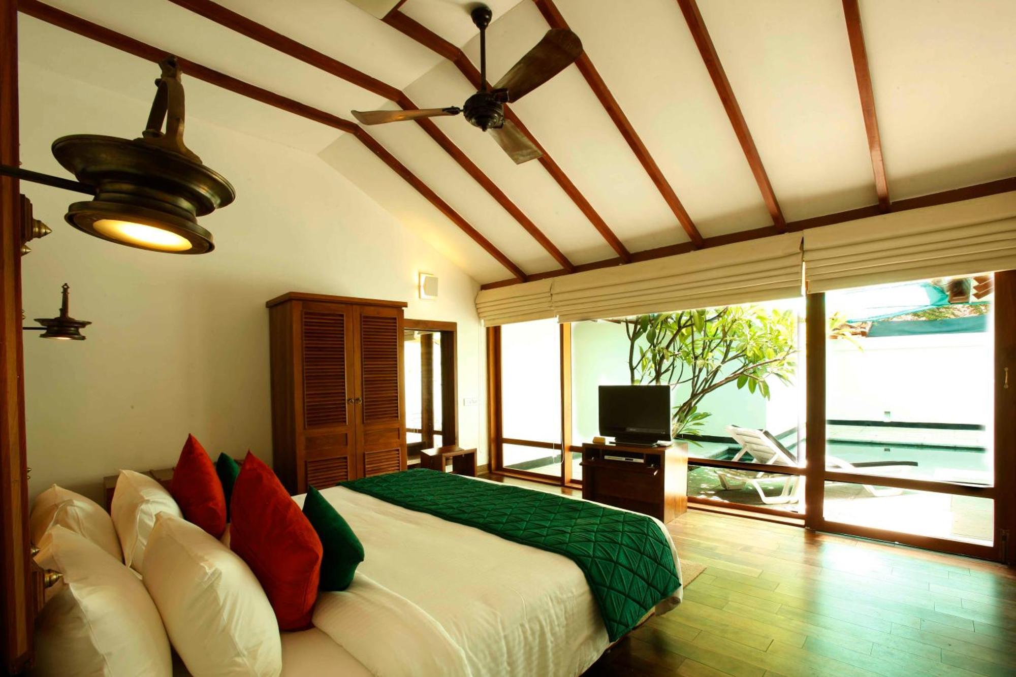 Heritage Madurai Pokoj fotografie A bedroom at the resort