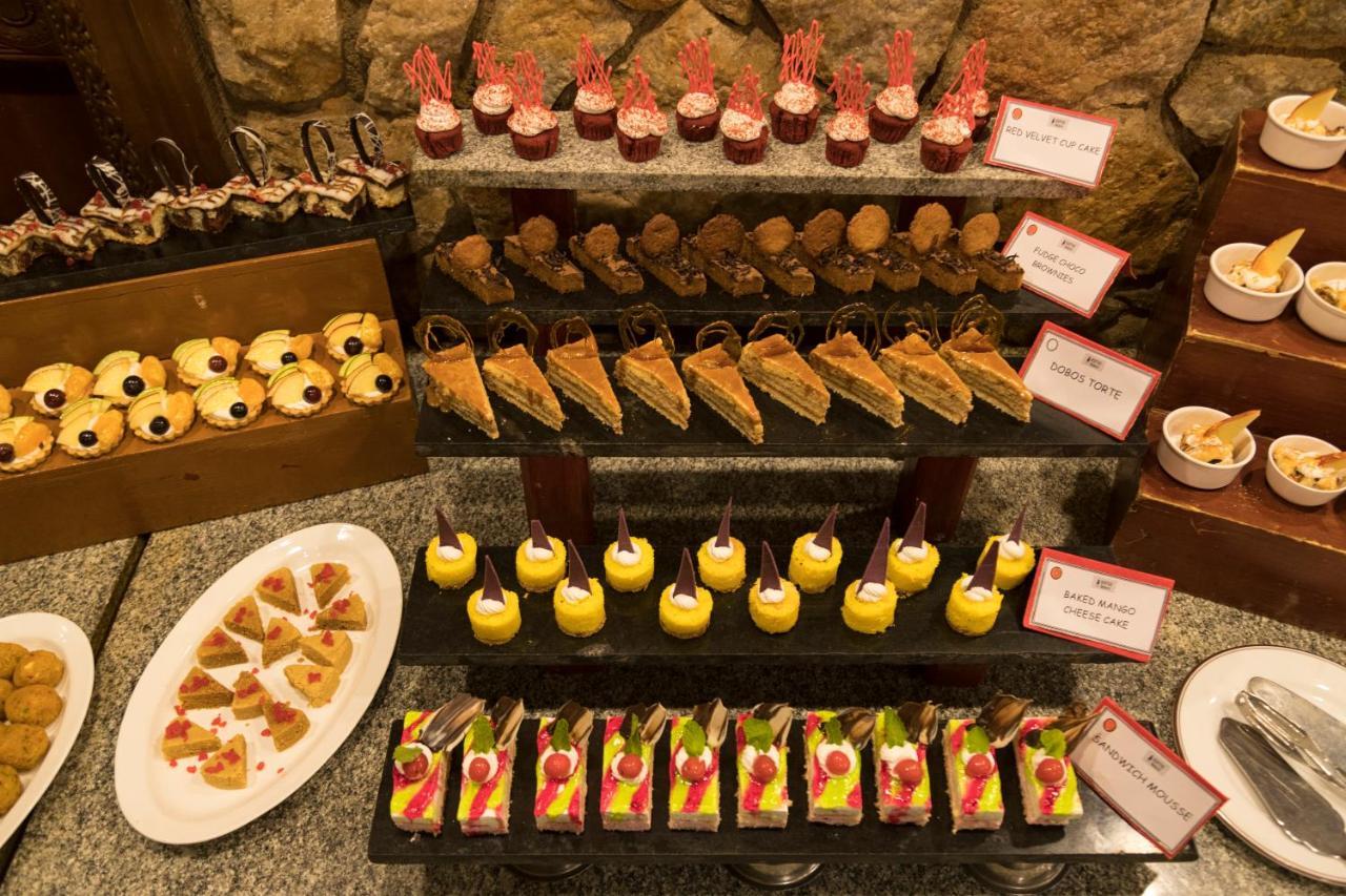 Heritage Madurai Exteriér fotografie A selection of desserts